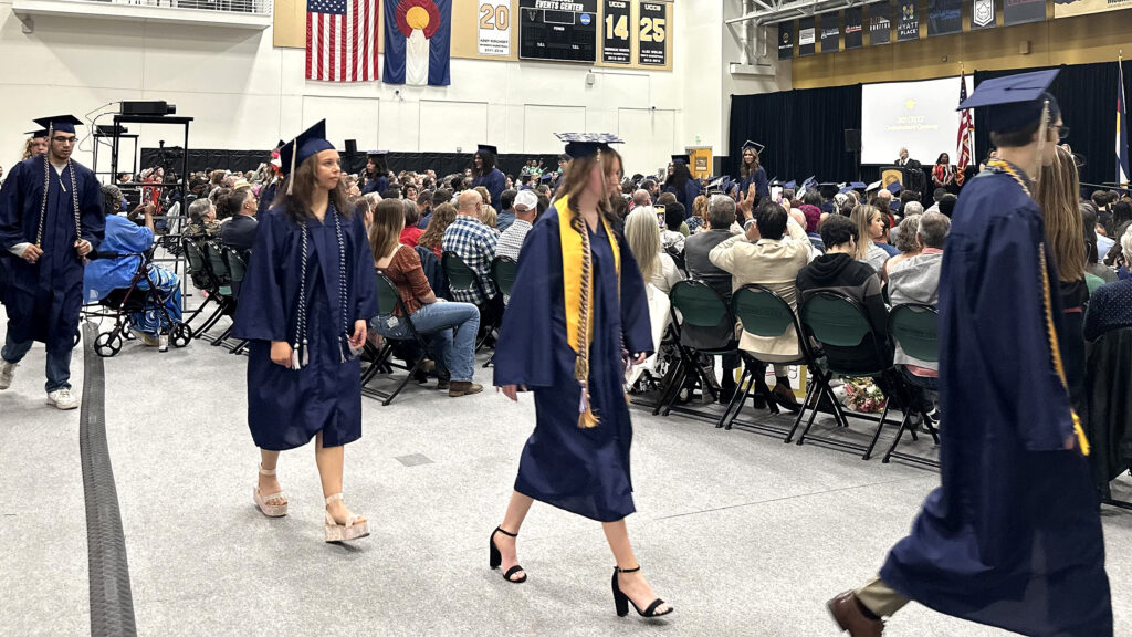 CEC Colorado Springs students walking into graduation.