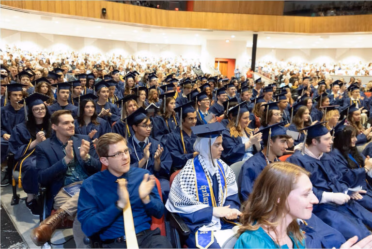 2025 CEC Fort Collins graduates sitting in the Aims Welcome Center clapping.