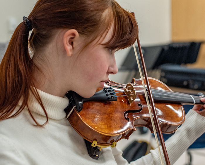 CECCR music student playing the violin.