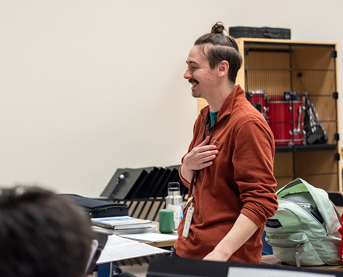 CECCR music teacher standing at the front of class.