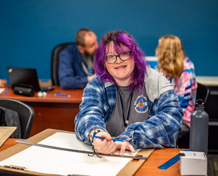 CECCS student working on a project in a classroom.