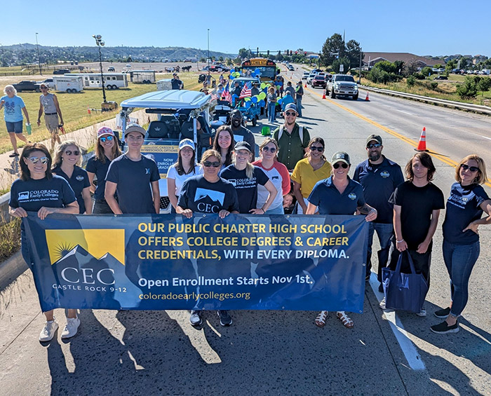 CECCR staff and students hold a banner and walk in the 2025 Douglas County parade.