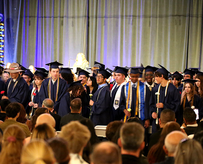 CEC Douglas County North 2025 graduates standing in an auditorium.