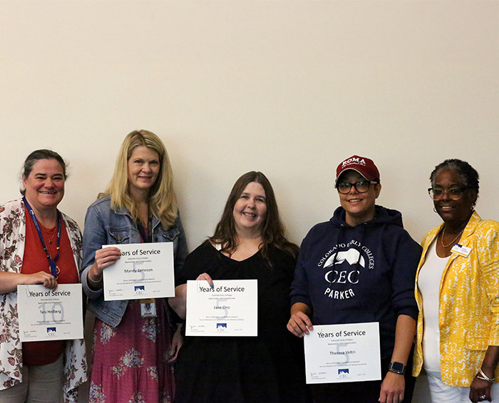 CEC DC North service award recipients pose with Laura Calhoun from the board of directors.