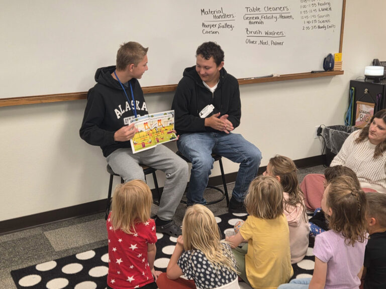 CEC Colorado Springs middle school students share a book they created in Canva with homeschool enrichment students.