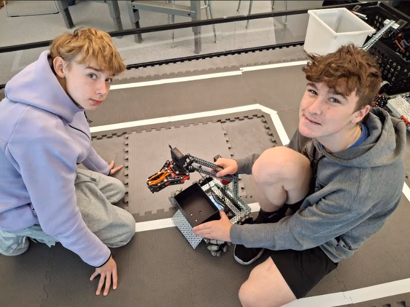 CEC Douglas County North students work on a robot during robotics class.