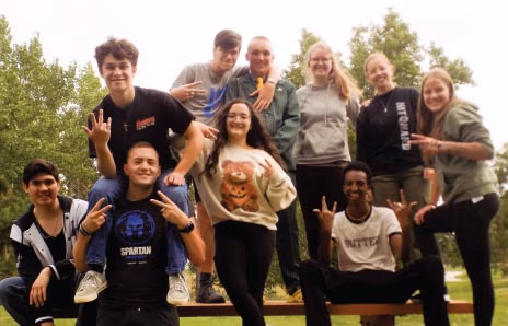CEC Douglas County North students posing for a picture on a picnic table.