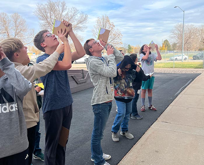 CECFC Middle School students work on a project outside the school.