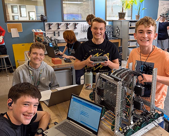 CECW robotics students working on a project in class.