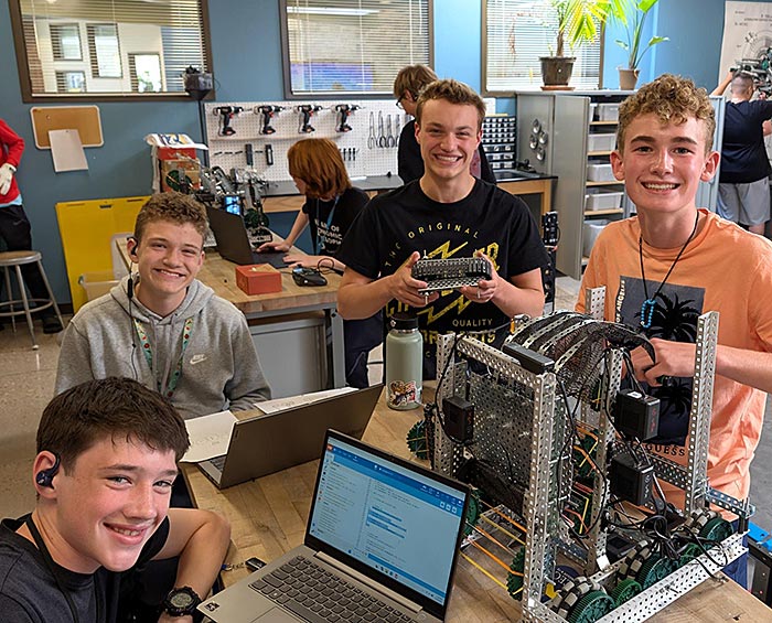 CECW robotics students working on a project in class.