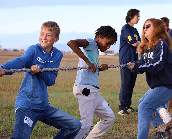 CECW Students play a game of tug of war.