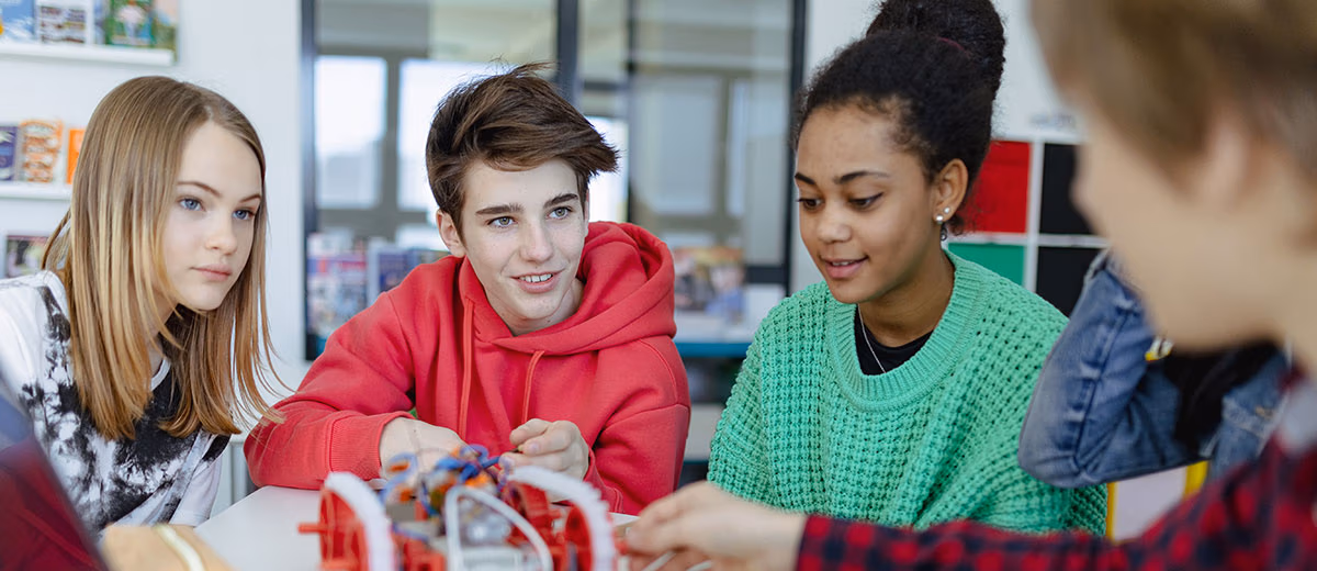 CEC Students work on a robotics project in class.
