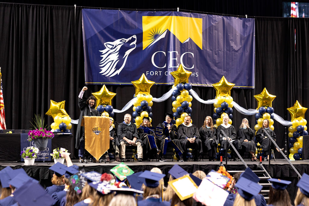 Graduation Commencement speaker Mr. Brennan Artrip and class seated