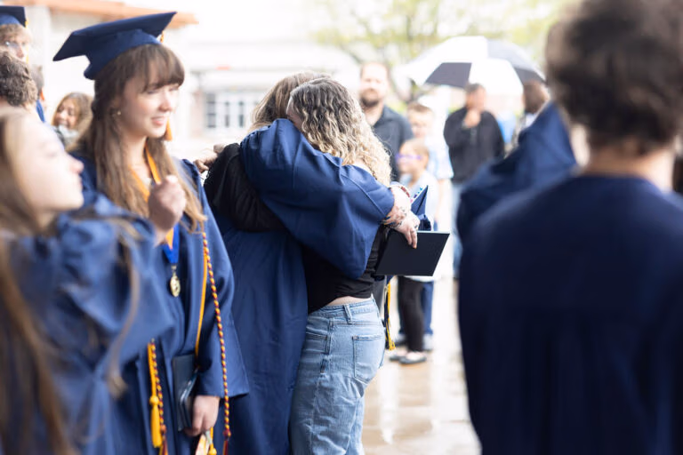CEC Fort Collins Graduates standing around after graduation.