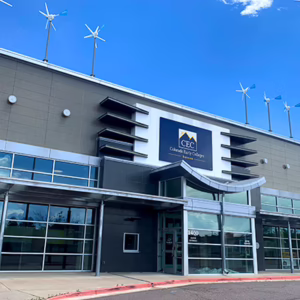 Colorado Early Colleges Aurora High School Campus exterior of building with windmills on the roof.